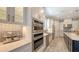 Beautiful kitchen featuring stainless steel appliances, sleek cabinets, and modern backsplash at 4717 Zeno Ct, Bradenton, FL 34211