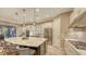 Spacious kitchen features stainless steel appliances, a large island with seating, and elegant pendant lighting at 4717 Zeno Ct, Bradenton, FL 34211