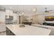 Spacious kitchen connecting to living room with island and modern stainless steel appliances at 4717 Zeno Ct, Bradenton, FL 34211