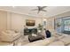 Cozy living room with comfortable seating, stylish decor, and view of backyard pool at 4717 Zeno Ct, Bradenton, FL 34211