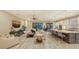 Bright living room connected to kitchen, featuring sliding doors to an outdoor area with a pool at 4717 Zeno Ct, Bradenton, FL 34211