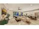 Open-concept living room seamlessly connected to a modern kitchen with stainless steel appliances at 4717 Zeno Ct, Bradenton, FL 34211