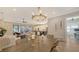 Open-concept living space featuring a modern kitchen, comfortable seating, and access to the outdoor area at 4717 Zeno Ct, Bradenton, FL 34211