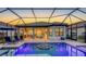 Beautiful outdoor pool and patio area featuring a covered lanai and lounge seating with a screened enclosure at 4717 Zeno Ct, Bradenton, FL 34211
