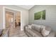 Comfortable study features natural light, wood-style flooring, a work area, and seamless integration with the dining room at 4717 Zeno Ct, Bradenton, FL 34211
