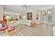 Spacious living room with contemporary furnishings and a view of the dining area at 4724 White Tail Ln, Sarasota, FL 34238