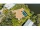 An aerial view reveals the home's screened-in pool and proximity to the lake at 4745 Antler Trl Trl, Sarasota, FL 34238