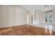 Large bright room with parquet and tile floors, featuring French doors and transom windows at 4745 Antler Trl Trl, Sarasota, FL 34238