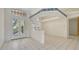 Bright living room featuring tile floors, large windows, and a charming floral wallpaper border at 4745 Antler Trl Trl, Sarasota, FL 34238