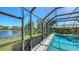 The screened-in pool provides hours of fun with lovely lake views at 4745 Antler Trl Trl, Sarasota, FL 34238