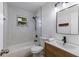 The bathroom features a tiled shower with tub, toilet, and modern vanity with a rectangular mirror at 5011 Live Oak Cir # 65, Bradenton, FL 34207