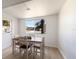 Cozy dining area featuring neutral decor, plank flooring, and an abundance of natural light at 5011 Live Oak Cir # 65, Bradenton, FL 34207