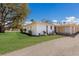 Well-maintained home with a large, green lawn, complemented by tasteful landscaping and a convenient covered carport at 5011 Live Oak Cir # 65, Bradenton, FL 34207