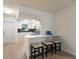 Bright kitchen with stainless appliances, eat-in breakfast bar with seating, and modern countertops at 5011 Live Oak Cir # 65, Bradenton, FL 34207