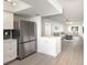 Modern kitchen with stainless steel appliances that opens up to a spacious living room and dining area at 5011 Live Oak Cir # 65, Bradenton, FL 34207
