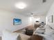 Spacious living room features an open layout with dining area, sleek floors, and contemporary furnishings at 5011 Live Oak Cir # 65, Bradenton, FL 34207