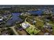 An exceptional waterfront property boasts lush greenery, a private pool, and serene views of the tranquil water at 503 1St Nw Ave, Ruskin, FL 33570