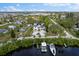 Lovely aerial view of a home in a waterfront community, complete with a boat dock and lush landscaping at 503 1St Nw Ave, Ruskin, FL 33570