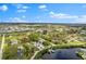 Sprawling community with a waterfront home, boat docks, and lush greenery under a sunny sky at 503 1St Nw Ave, Ruskin, FL 33570