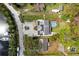 Overhead view showcases a home with solar panels and a pool, nestled within a friendly neighborhood at 503 1St Nw Ave, Ruskin, FL 33570