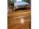 Bedroom featuring hardwood floors, a window, and a bed with a decorative starfish comforter at 503 1St Nw Ave, Ruskin, FL 33570