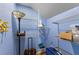 Bright blue closet with white wire shelving and storage for clothes and suitcases at 503 1St Nw Ave, Ruskin, FL 33570