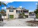 Charming two-story home with a well-manicured yard and a driveway at 503 1St Nw Ave, Ruskin, FL 33570