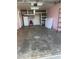 Spacious garage with painted walls, storage shelves, and ample room for parking at 503 1St Nw Ave, Ruskin, FL 33570