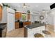 Open kitchen with granite countertops, wooden cabinetry, and a breakfast bar with seating at 503 1St Nw Ave, Ruskin, FL 33570