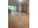 Bright and airy room with tile flooring, sliding glass door, and a view of the outdoors at 503 1St Nw Ave, Ruskin, FL 33570