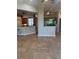 Spacious living room showcasing a large aquarium that separates the living room and kitchen at 503 1St Nw Ave, Ruskin, FL 33570