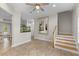 Open-concept home featuring tile floors, staircase, and a decorative aquarium at 503 1St Nw Ave, Ruskin, FL 33570