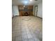 Large living room with tiled floors, bar area, and natural light at 503 1St Nw Ave, Ruskin, FL 33570