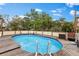 The backyard contains a wooden deck surrounding an above-ground pool at 503 1St Nw Ave, Ruskin, FL 33570