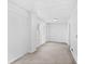 A bright room with white walls, compact windows, and concrete flooring at 503 1St Nw Ave, Ruskin, FL 33570
