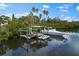 Beautiful waterfront home featuring a private boat dock and lift, ideal for enjoying aquatic adventures at 503 1St Nw Ave, Ruskin, FL 33570