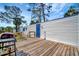 View of back of home with a door to a wooden deck at 5061 Placida Rd # A, Englewood, FL 34224