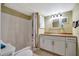 Bathroom featuring a shower and tan colored tile flooring at 5061 Placida Rd # A, Englewood, FL 34224