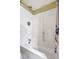 Bathroom featuring a bathtub, shower combo and shower caddy at 5061 Placida Rd # A, Englewood, FL 34224