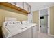 Laundry room with tile floors, washer, and dryer at 5061 Placida Rd # A, Englewood, FL 34224