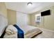 Bedroom featuring a window for natural light, and tan colored tile flooring at 5061 Placida Rd # A, Englewood, FL 34224