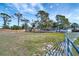 Cleared lot with mobile home, storage buildings, and wood and chain link fencing at 5061 Placida Rd # A, Englewood, FL 34224