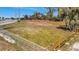 Cleared lot ready for your dream home with mature trees and wood and chain link fencing at 5061 Placida Rd # A, Englewood, FL 34224