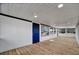 Bright sunroom featuring wood flooring, white walls, and large windows offering plenty of natural light at 5061 Placida Rd # A, Englewood, FL 34224