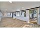 Bright sunroom with wood floors, featuring large windows, and filled with natural light at 5061 Placida Rd # A, Englewood, FL 34224