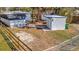 Yard featuring a storage building and mobile home with wood and chain link fencing at 5061 Placida Rd # A, Englewood, FL 34224