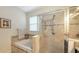 Relaxing bathroom with a tub and shower, with tile surround, and a large window at 5068 Inshore Landing Dr, Apollo Beach, FL 33572