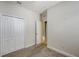 Bedroom showcasing carpet, white trim, and a closet for storage at 5068 Inshore Landing Dr, Apollo Beach, FL 33572