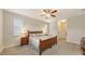 Spacious bedroom with plush carpeting, warm lighting, and a neutral color palette at 5068 Inshore Landing Dr, Apollo Beach, FL 33572