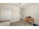 Cozy bedroom featuring a closet, neutral carpet, and desk, perfect for a relaxing and productive space at 5068 Inshore Landing Dr, Apollo Beach, FL 33572